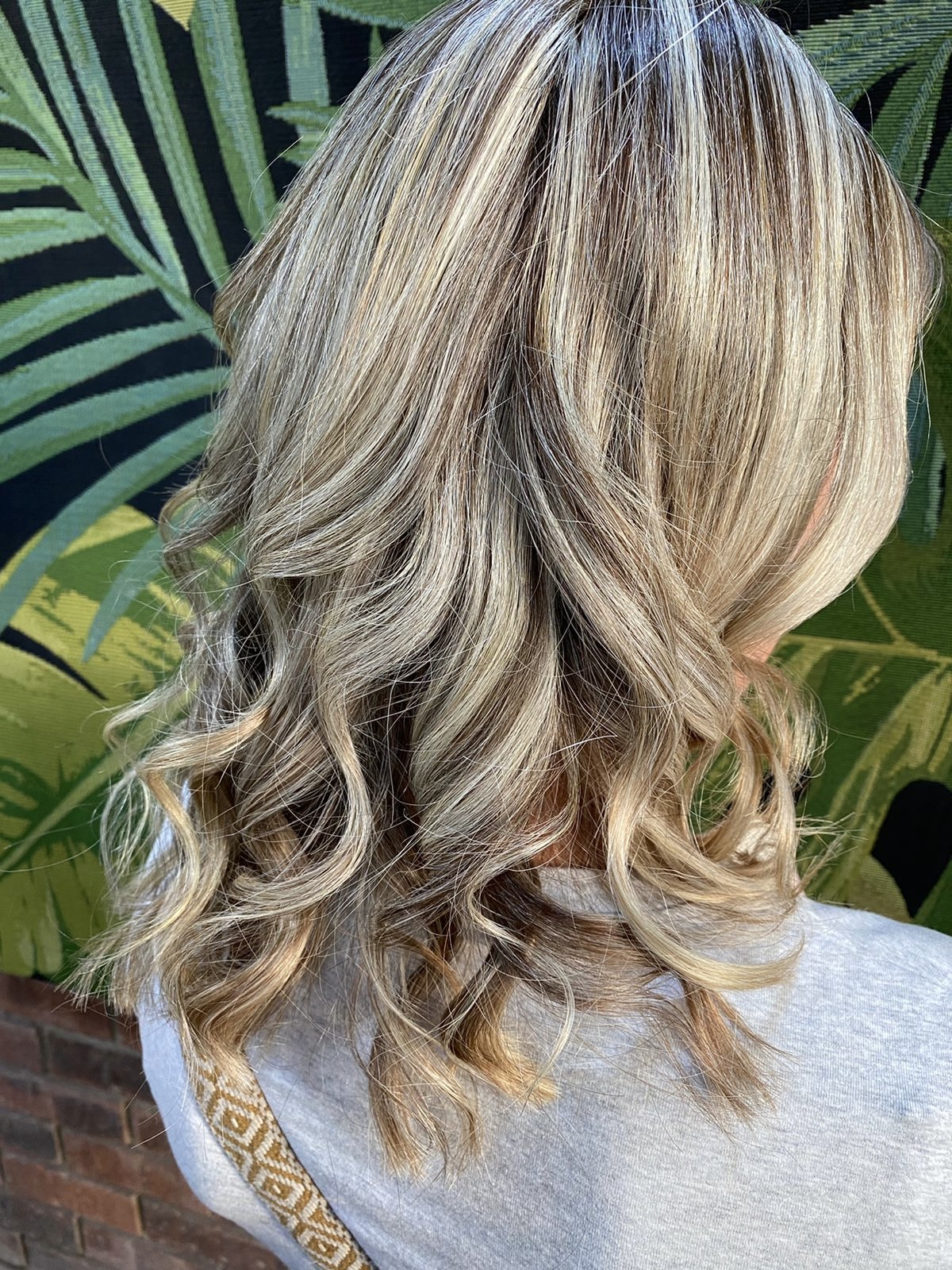 Fresh blonde balayage with soft waves